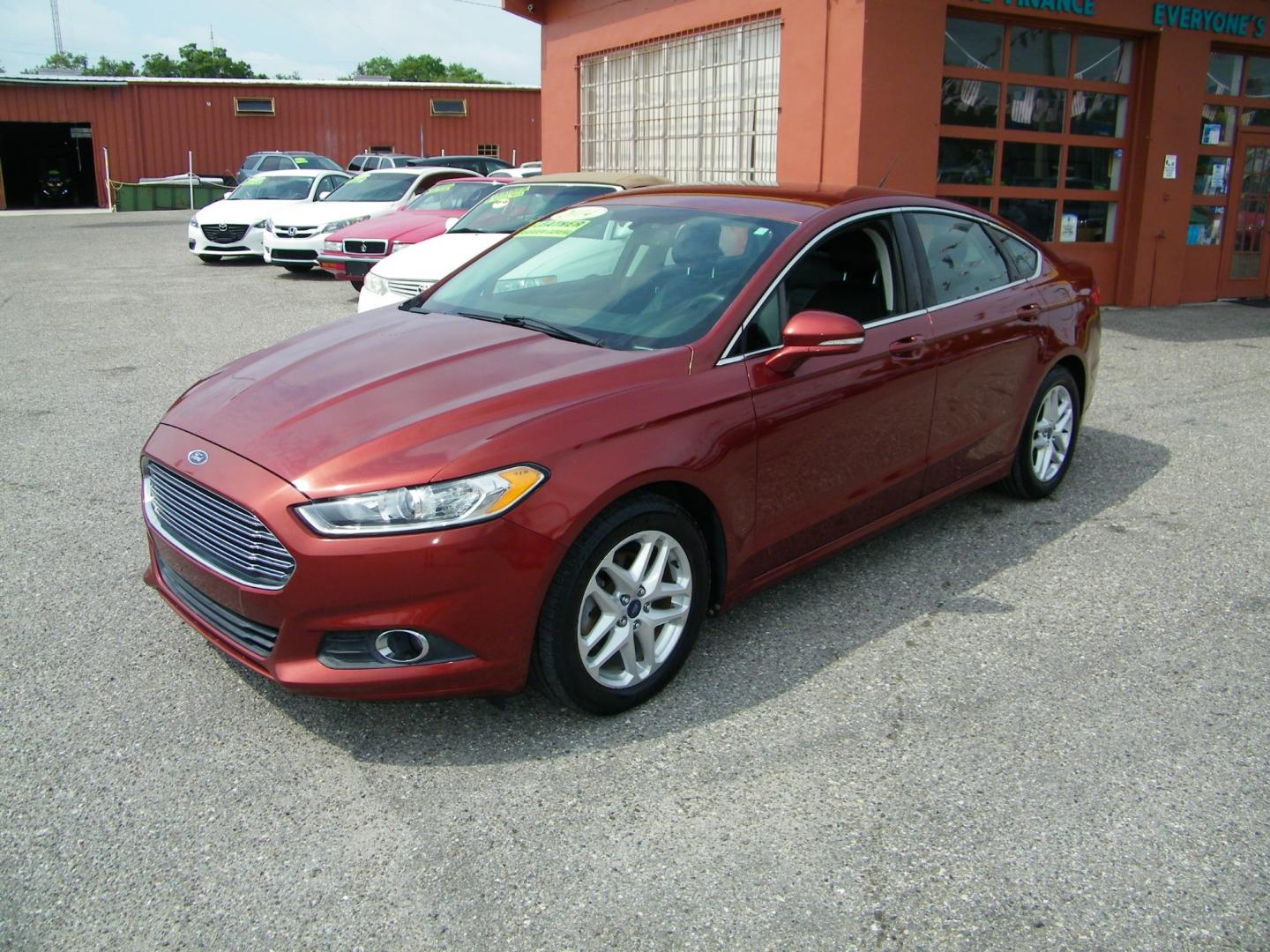 2014 Orange /Black Ford Fusion SE (3FA6P0HD7ER) with an 1.5L L4 DOHC 16V engine, Automatic transmission, located at 4000 Bee Ridge Road, Sarasota, FL, 34233, (941) 926-0300, 27.298664, -82.489151 - Photo#0